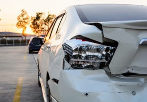 cracked-up rear-end of a white car