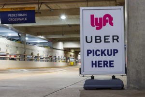Lyft and Uber pick-up sign in a parking garage