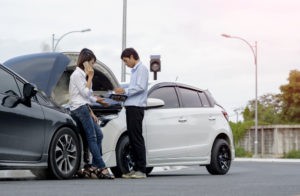 drivers calling for help and sharing information after a car accident