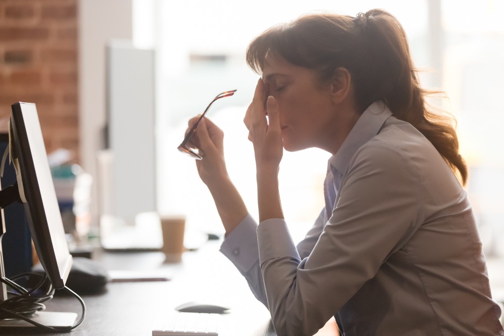  female worker sit at office desk